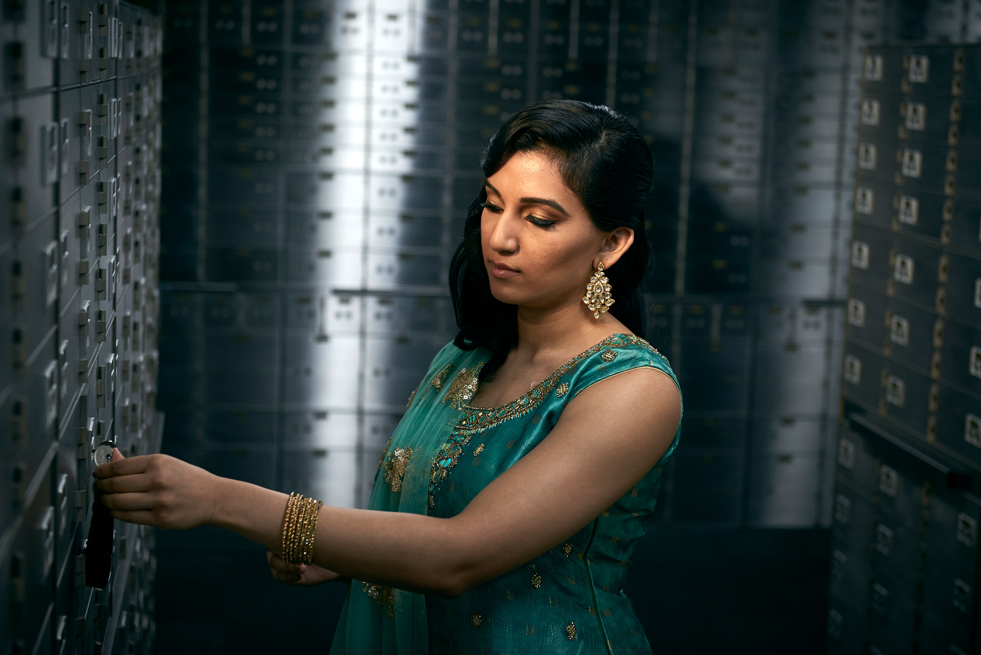 Punjabi indian lady opening a safety deposit box