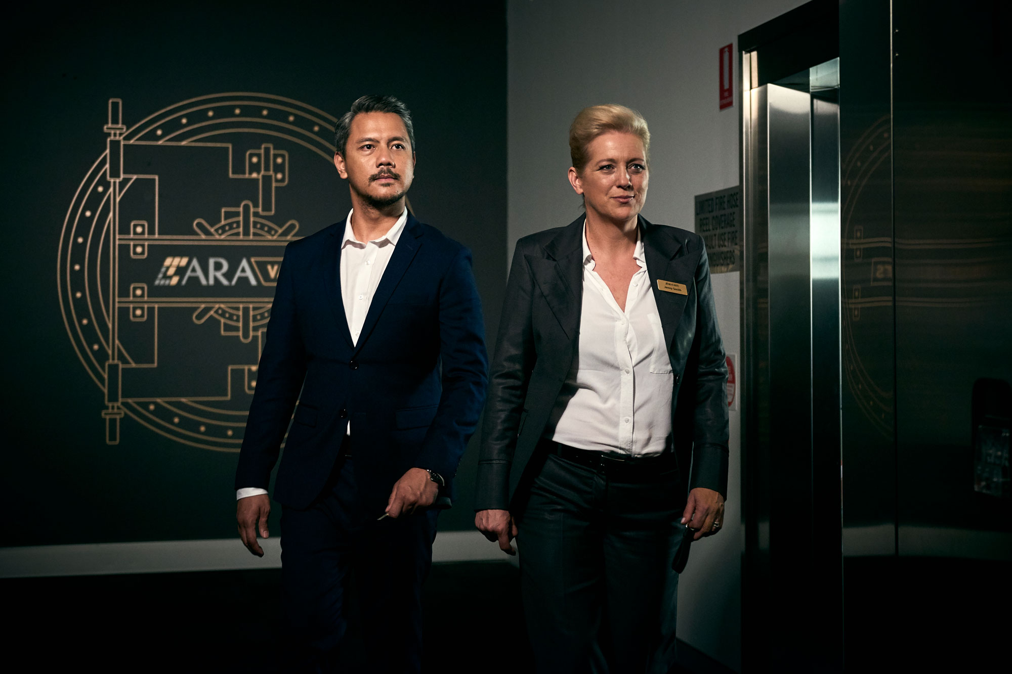 man and woman walking into Safeguard Locker Securityprivate security vault